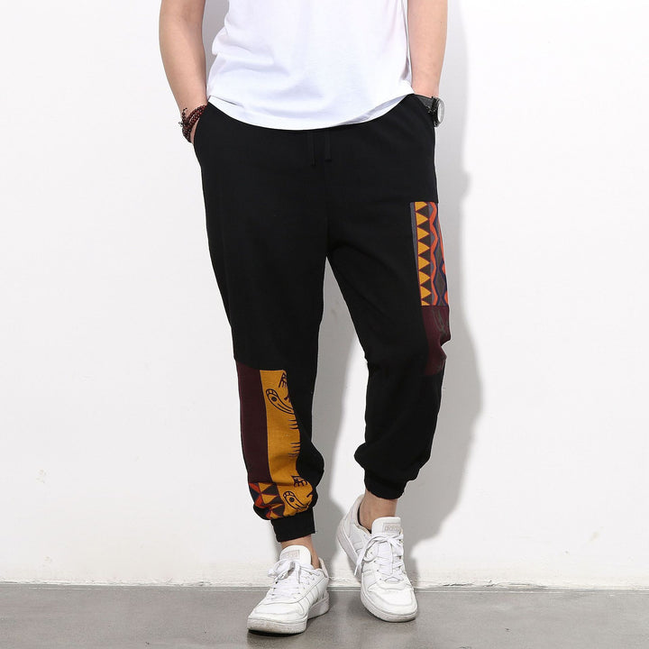 Men's jogging pants with side panel prints, drawstring and ribbed cuffs Mune Fashion