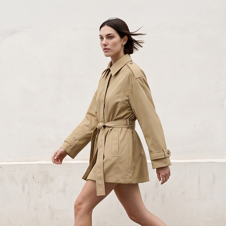 Women's short trench coat with waist belt, shoulder flaps, and adjustable cuffs Mune Fashion