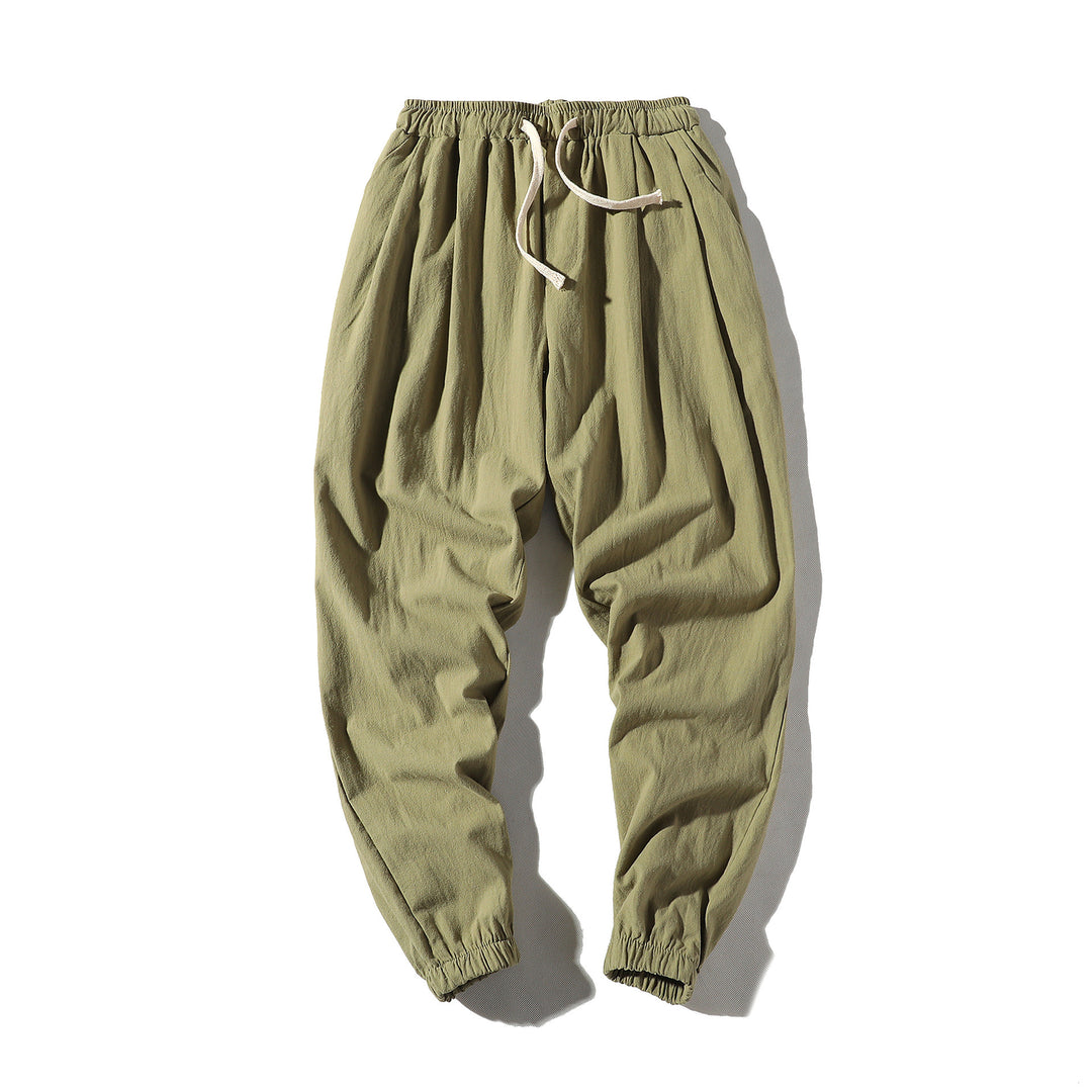 Men's loose joggers with elastic waistband, drawstring, side pockets, and elastic cuffs Mune Fashion