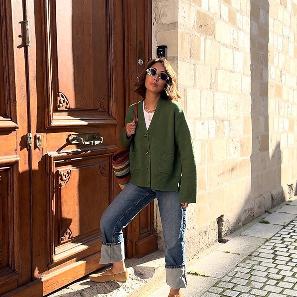 Women's oversized knit cardigan with decorative button placket, patch pockets, and elongated cuffs Mune Fashion