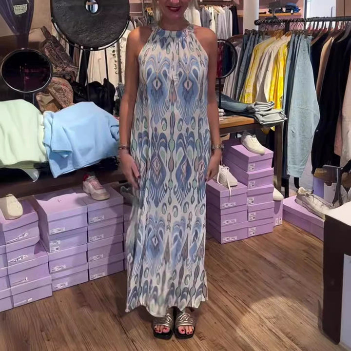 Women's flowing maxi dress with halter neck, ornamental ikat print and wide fall Mune Fashion
