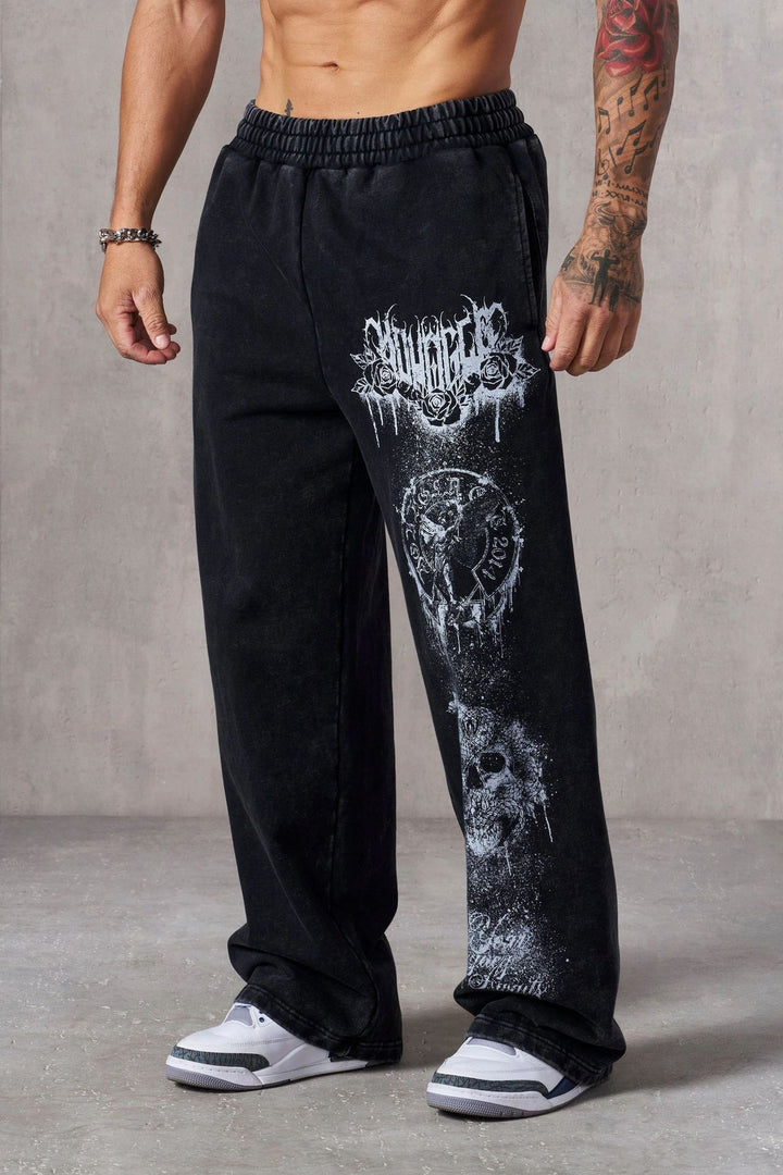 Men's baggy joggers with elastic waistband, side pockets and detailed skull and rose motif Mune Fashion