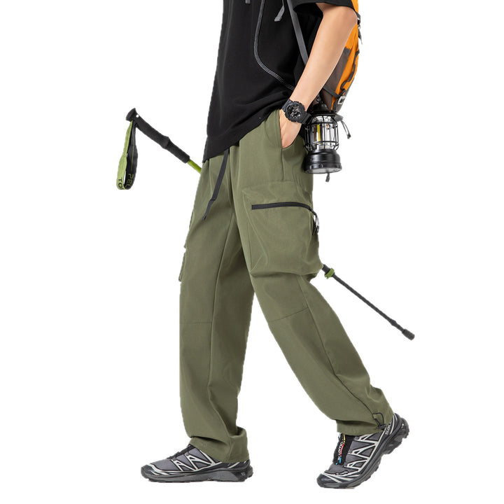 Men's loose technical cargo pants with multi-functional pockets, drawstring waistband, and adjustable leg closures Drune