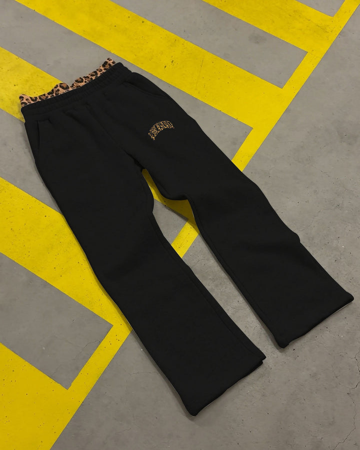 Women's high-cut jogging pants with flared leg, elastic ruffled waistband and leopard stitch detail Mune Fashion