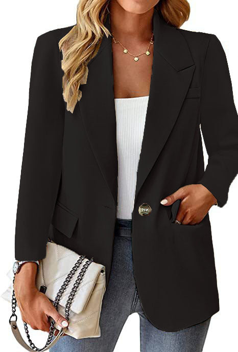 Ladies longline blazer in oversized style with a striking lapel, metal button, and patch pockets Mune Fashion