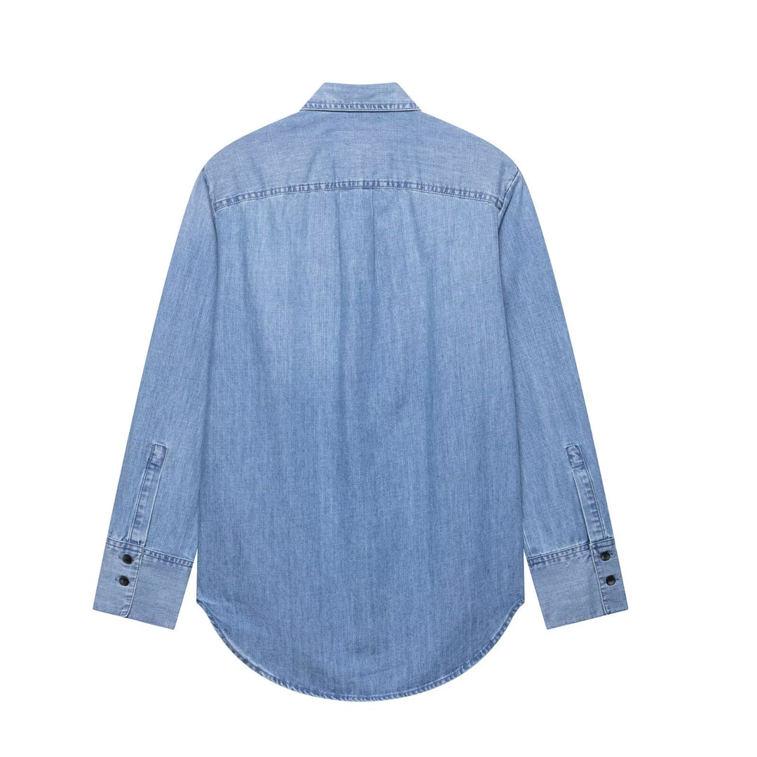 Women's chambray blouse with ruffled button placket, shirt collar and extended hem Mune Fashion