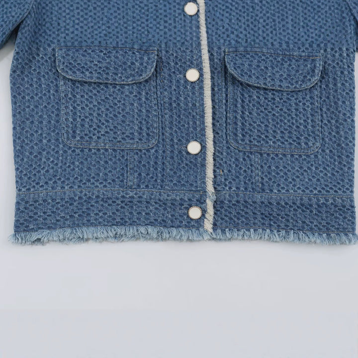 Women's short jacket made of textured denim with fringe trim and flap pockets Mune Fashion