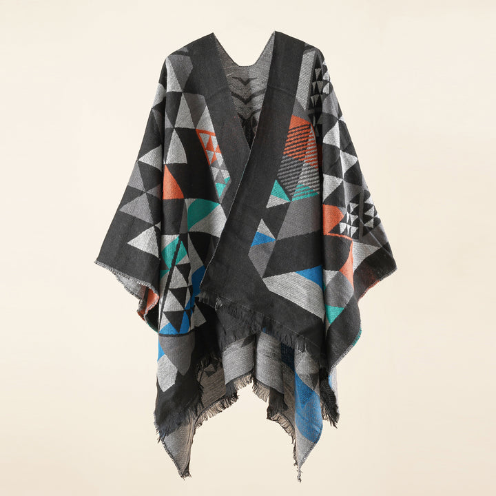 Women's oversized ruana in jacquard wrap style with triangular pattern and fringe hem Mune Fashion