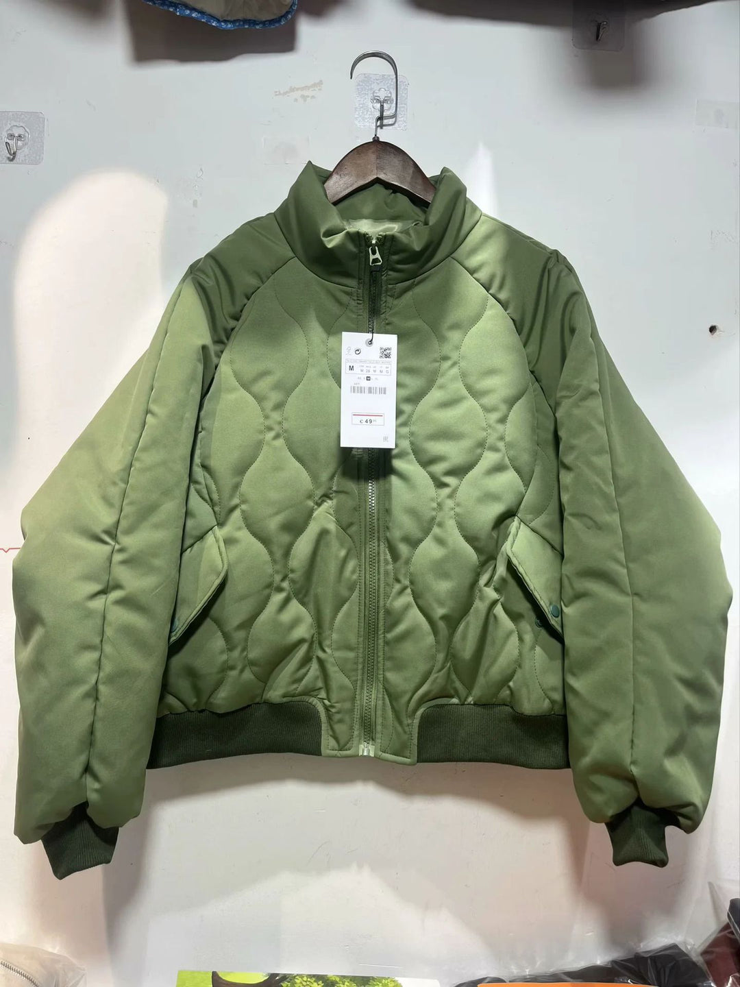Women's quilted bomber jacket with high stand-up collar, lightweight thermal padding, and ribbed cuffs Mune Fashion