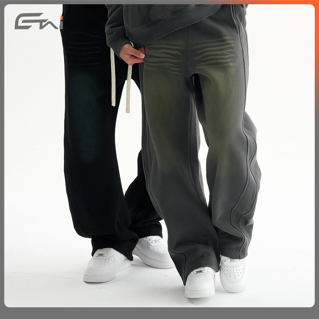 Men's baggy sweatpants with low crotch, contrasting decorative seams, and extra long drawstrings.