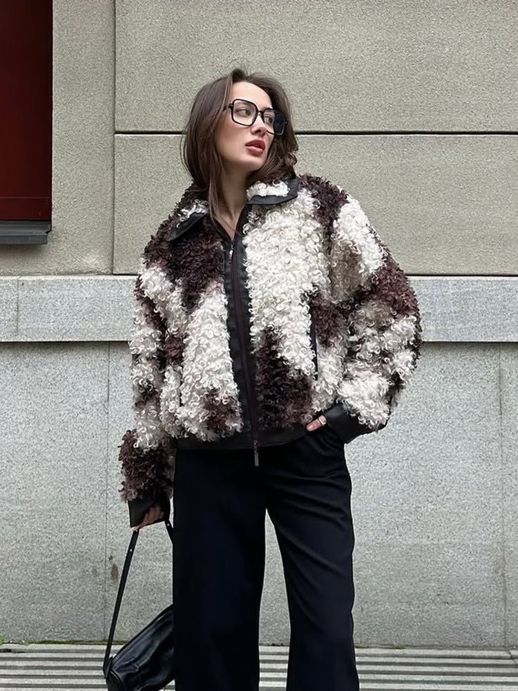 Women's short jacket made of curly bouclé faux fur with leather look detailing Mune Fashion