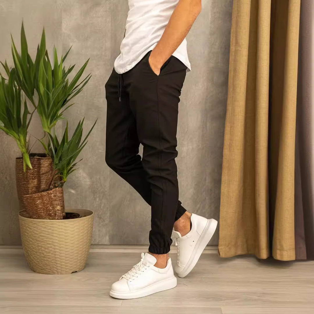 Men's slim fit jogging pants with elastic waistband, drawstring, and ribbed ankle cuff Mune Fashion