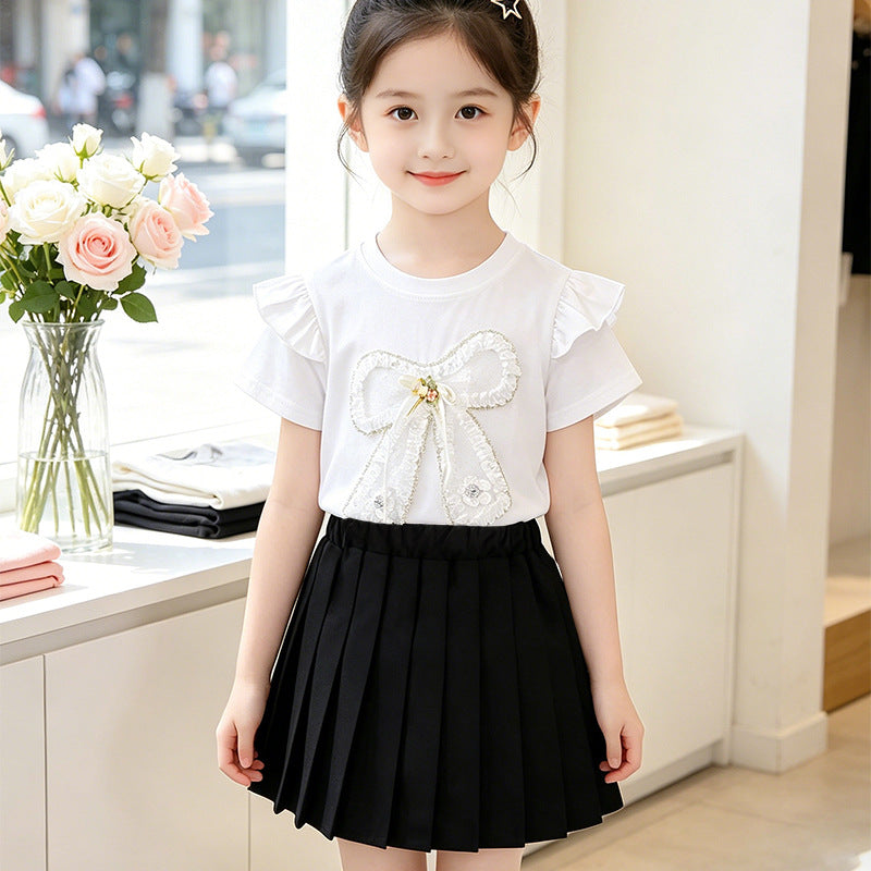 Girl's T-shirt with romantic bow motif and ruffle details Mune Fashion