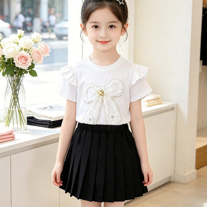 Girl's T-shirt with romantic bow motif and ruffle details Mune Fashion