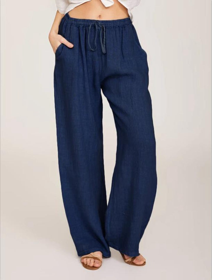 Women's airy palazzo pants with drawstring waistband, elastic waist finish, and side pockets Mune Fashion