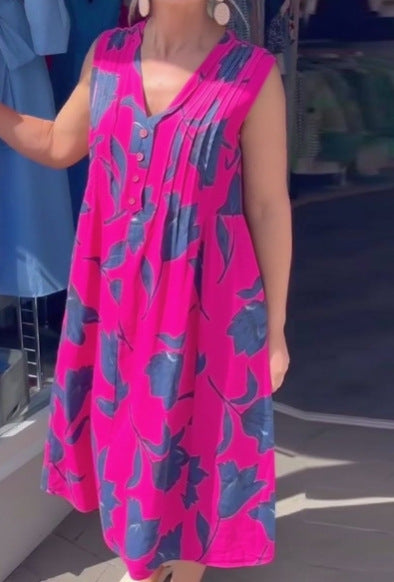 Women's sleeveless A-line midi dress with V-neck, bust pleats, button placket, and large floral print Mune Fashion