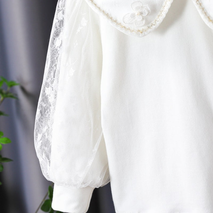 Women's blouse with decorative floral appliqués and transparent puff sleeves Mune Fashion