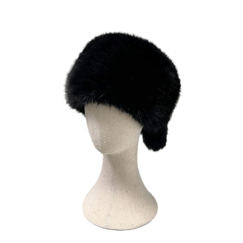 Women’s plush faux fur trapper hat with earflaps and decorative tail Mune Fashion