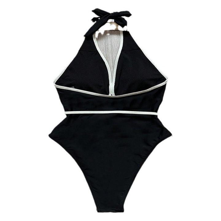 Women's elegant one-piece swimsuit with sophisticated cut-outs and floral belt Mune Fashion