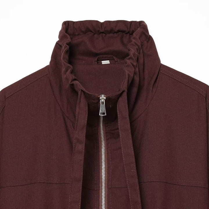 Women's short bomber-style jacket with high funnel collar, concealed zipper, and flap pockets Mune Fashion