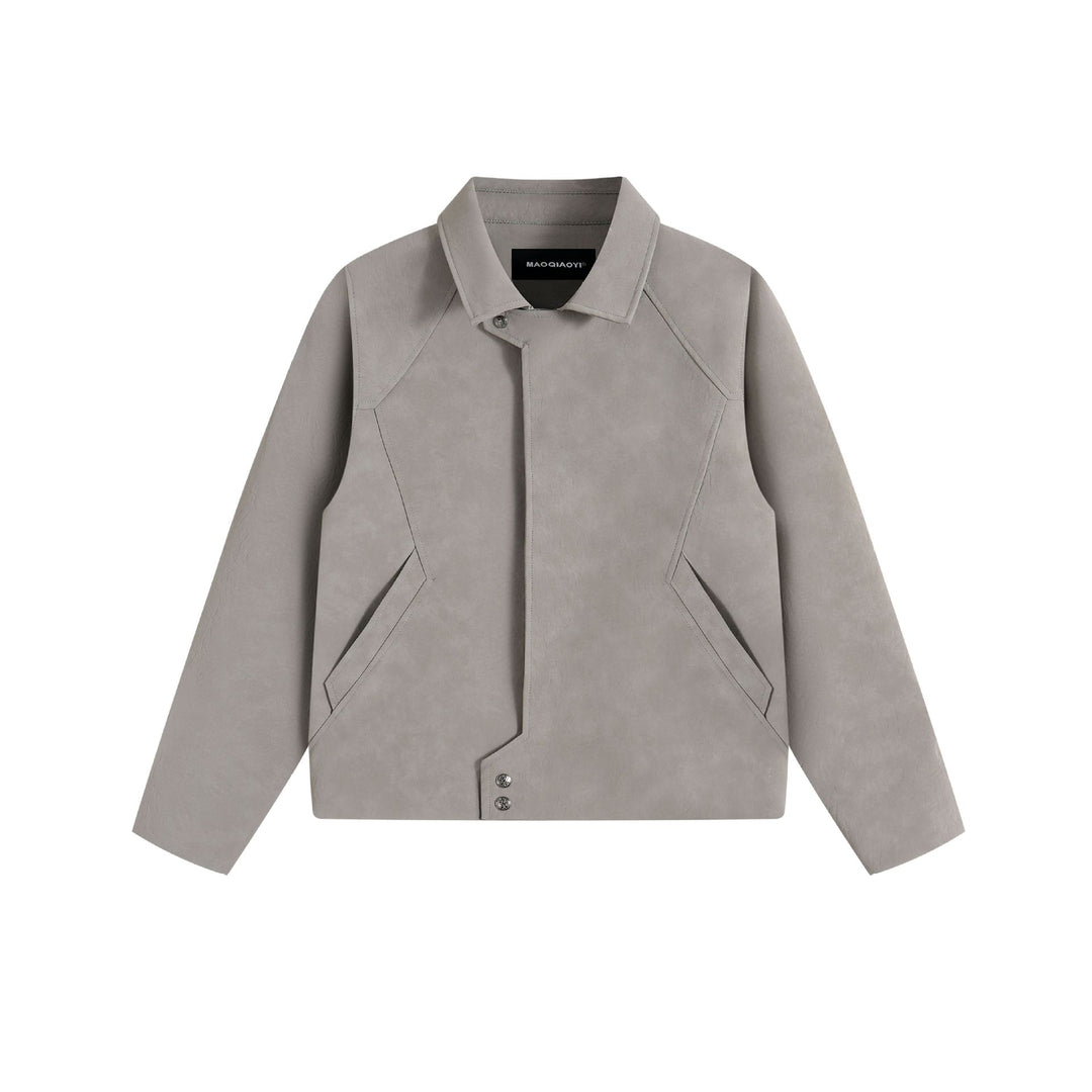 Men's short jacket in suede look with asymmetric front flap and geometric flap pockets.