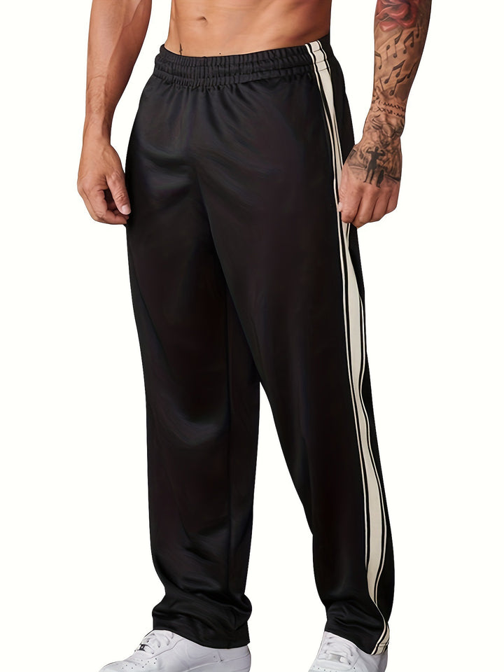 Men's sporty training pants with side tape stripes and elastic waistband Mune Fashion