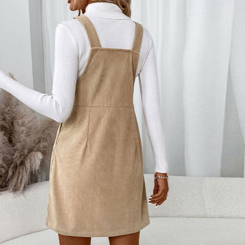 Women's corduroy bib dress with adjustable straps, patch chest pocket, and side button placket Mune Fashion
