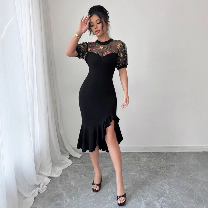 Women's figure-hugging midi dress with embroidered mesh top, puff sleeves, and asymmetrical ruffled hem Mune Fashion