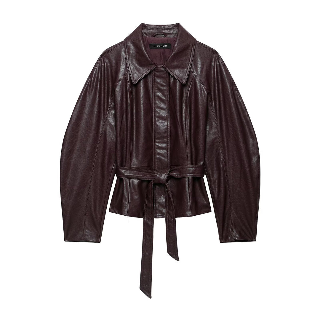 Women's short jacket made of vegan leather with a waist tie belt and dropped raglan sleeve construction Mune Fashion