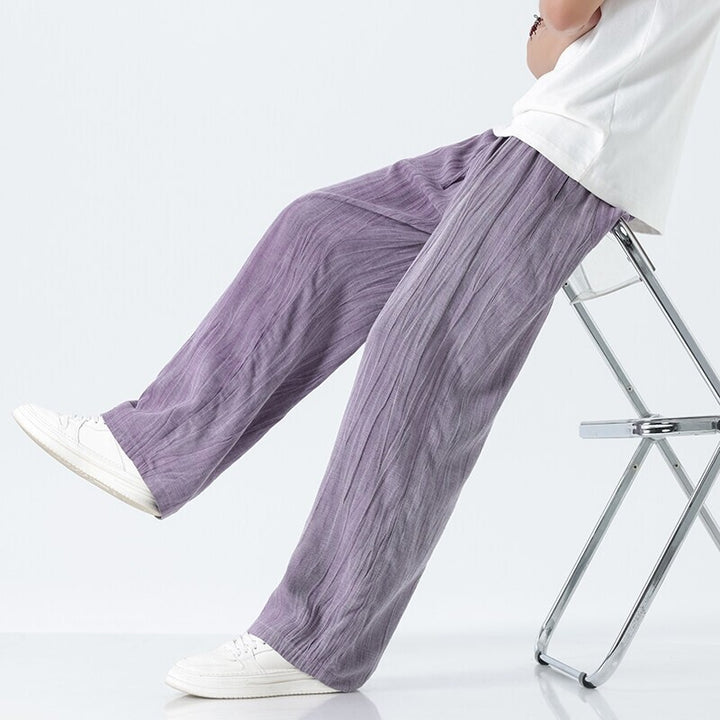 Men's loose linen trousers with adjustable drawstring waistband, casual pleat look, and side pockets Mune Fashion