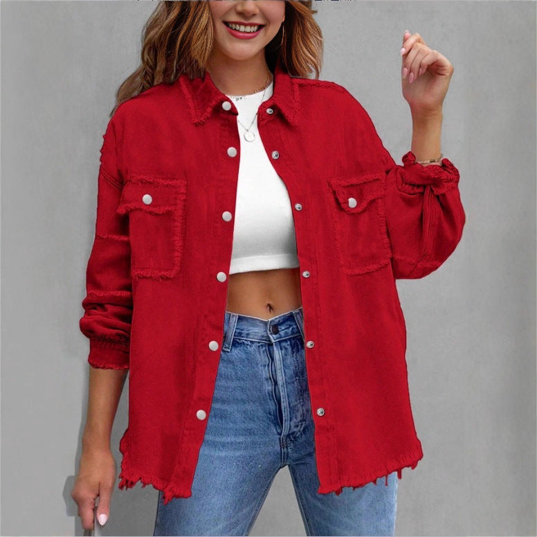 Women's oversized denim shirt jacket with fringe trim, flap pockets, and snap front Mune Fashion