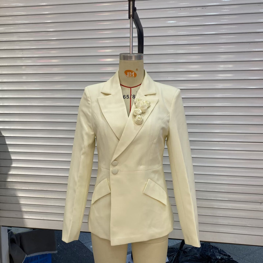 Women's tailored two-button blazer with decorative roses at the lapel and patch pockets Mune Fashion