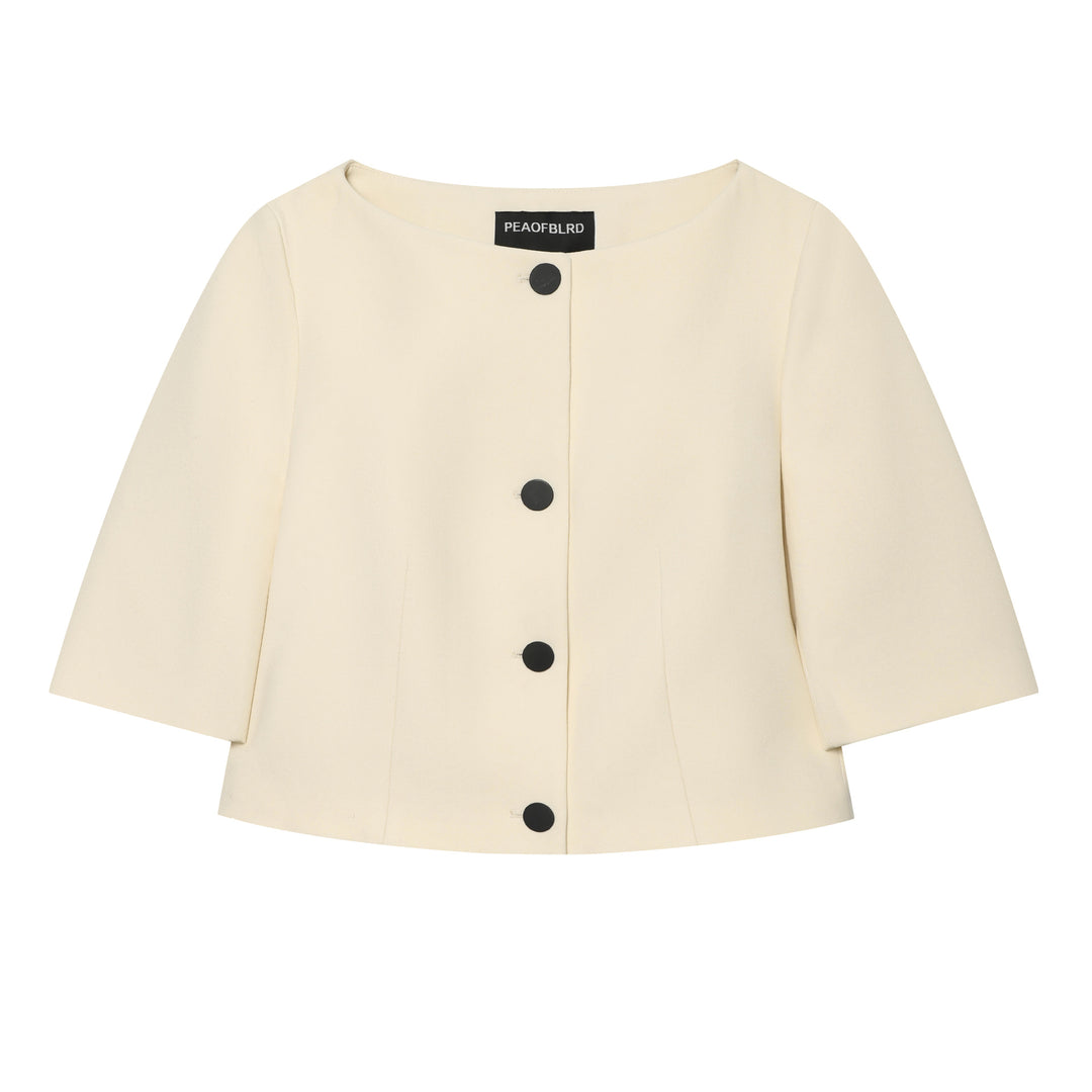 Women's tailored boxy short jacket with round neck, three-quarter sleeves and decorative button placket Mune Fashion