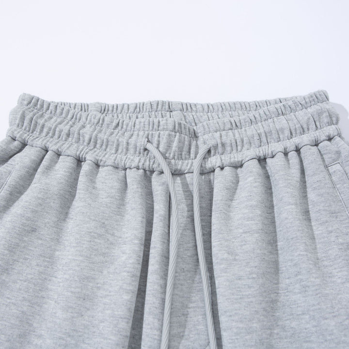 Unisex Wide French-Terry Sweatpants with elastic drawstring waistband, side pockets, and adjustable hem.