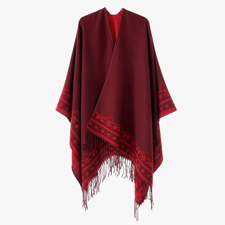 Women's poncho wrap made of wool blend with subtle jacquard border pattern and fringed hem Mune Fashion