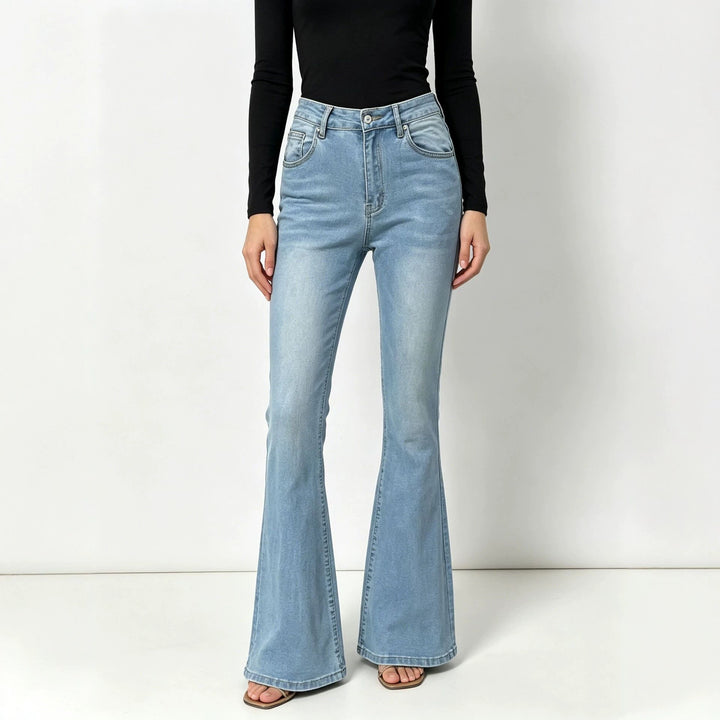 Ladies high-waisted jeans with a narrow hip area and wide flare with elastic waistband Mune Fashion
