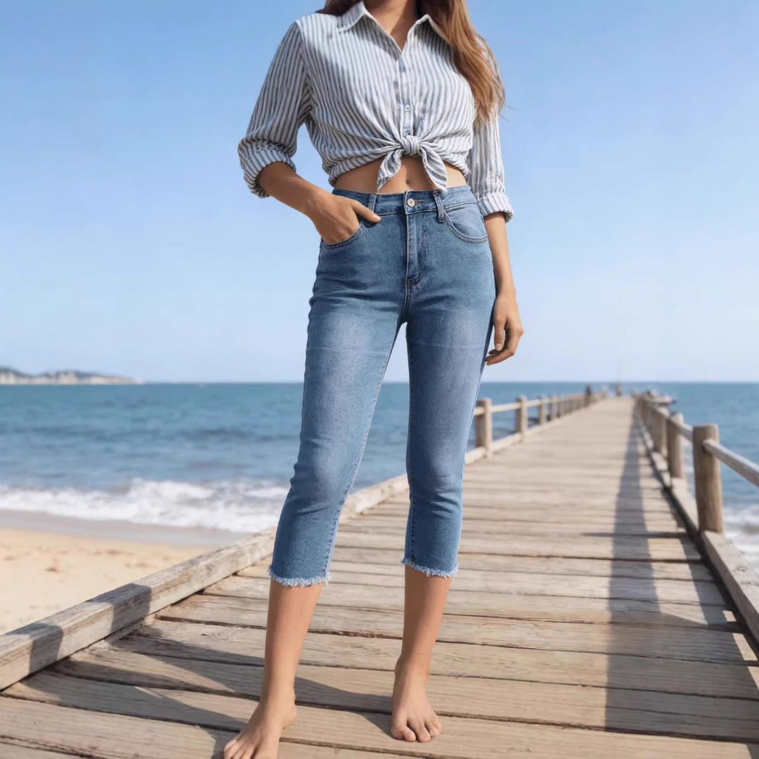 Women's narrow ankle-length jeans with raw fringe finish and mid-rise waist Mune Fashion