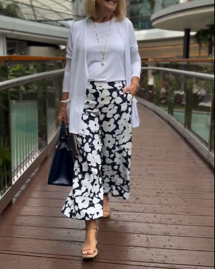 Women's wide Palazzo pants with large floral print, high waistband and side pockets Mune Fashion