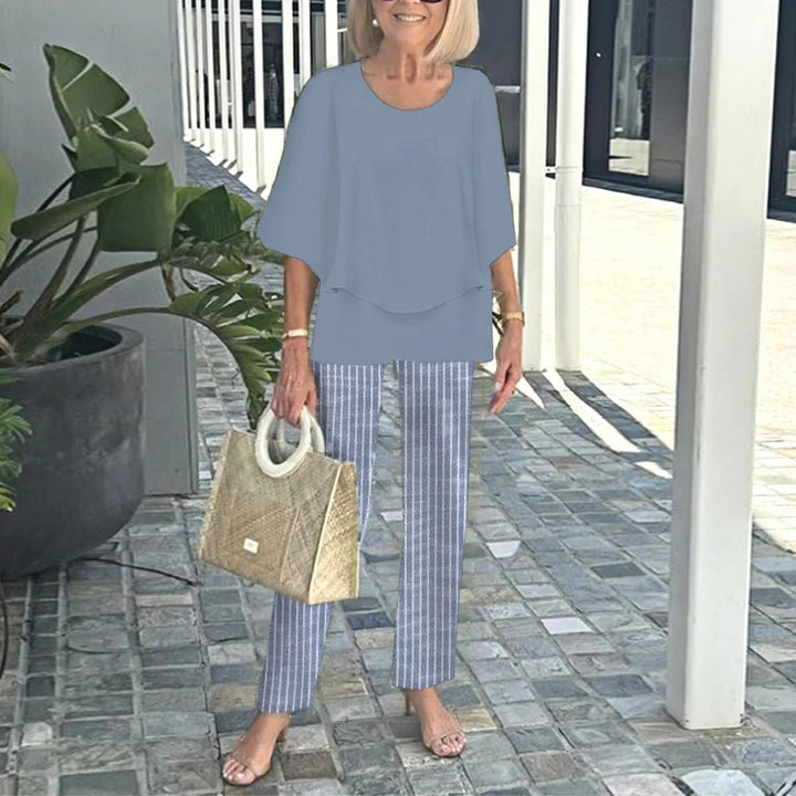 Women's layered tunic with cape sleeves and ankle-length straight leg pants with graphic print Mune Fashion