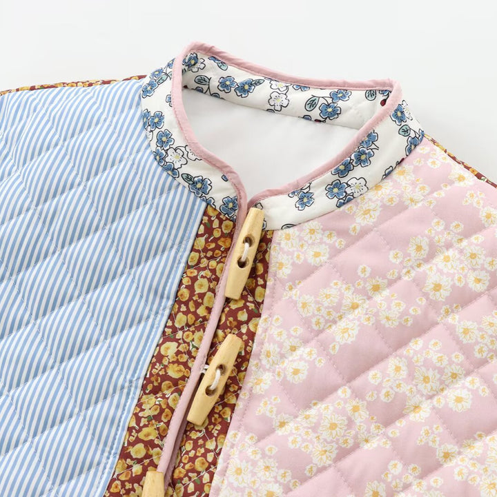 Ladies' retro-inspired quilted patchwork jacket with stand-up collar, wood button closures, and flap pockets Mune Fashion