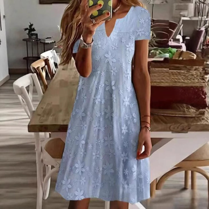 Women's knee-length A-line dress made of cotton blend with embroidered broderie overlay, short sleeves and V-neck Mune Fashion