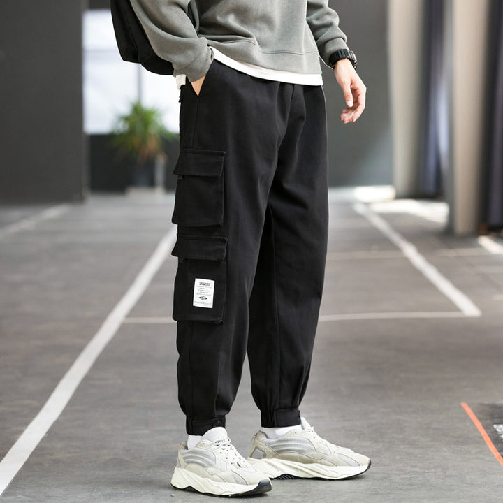 Men's nan cargo jogger pants with multiple patch pockets, elastic waistband, and gathered ankles Mune Fashion
