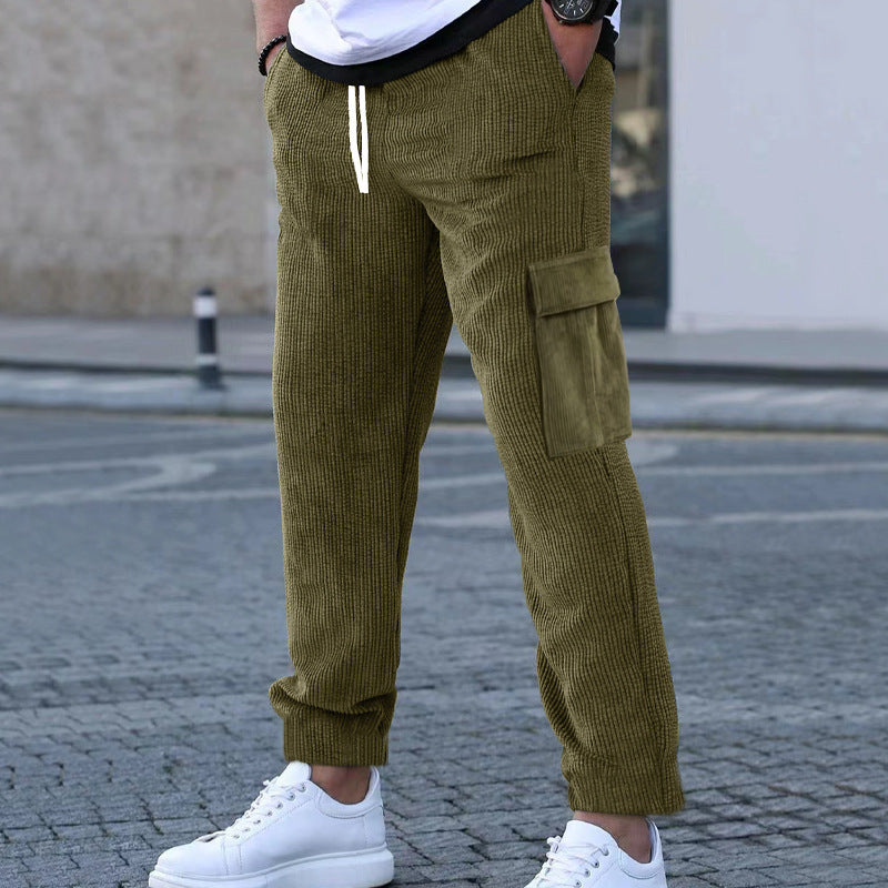 Men's corduroy jogger-style pants with elastic drawstring waistband, flap cargo pockets, and tapered leg Mune Fashion