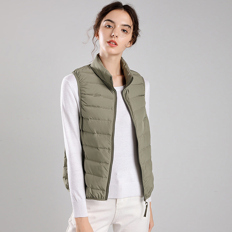 Women's packable quilted vest with flat down look, stand-up collar and side slip pockets Mune Fashion