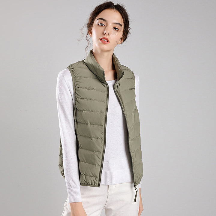 Women's packable quilted vest with flat down look, stand-up collar and side slip pockets Mune Fashion