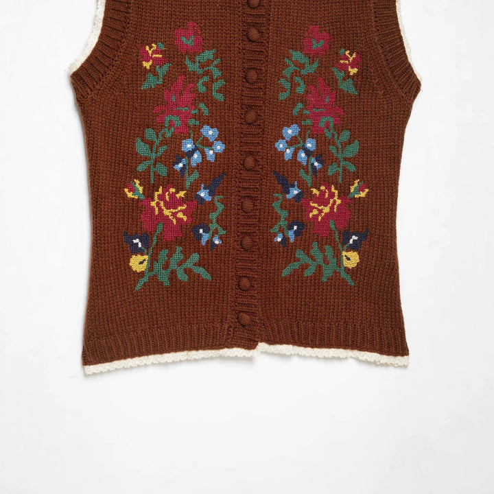 Women's sleeveless knitted vest with floral intarsias, button placket and crocheted hem Mune Fashion