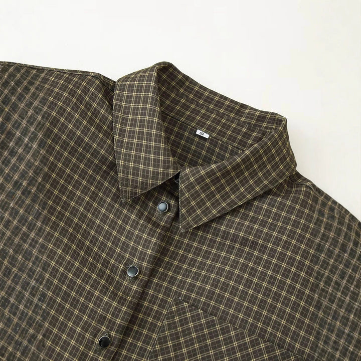 Women's oversized checkered shirt blouse with patch chest pocket and rounded hem Mune Fashion