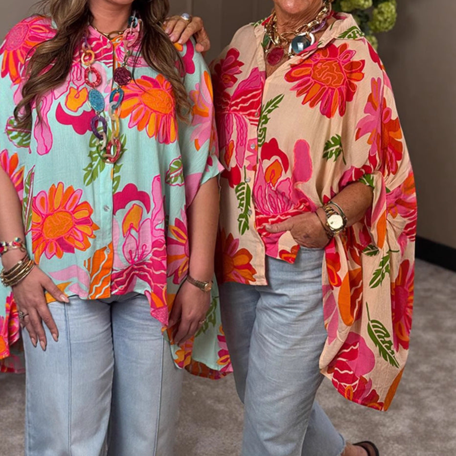 Women's airy oversized resort-style shirt blouse with large floral print and asymmetrical scalloped hem Mune Fashion
