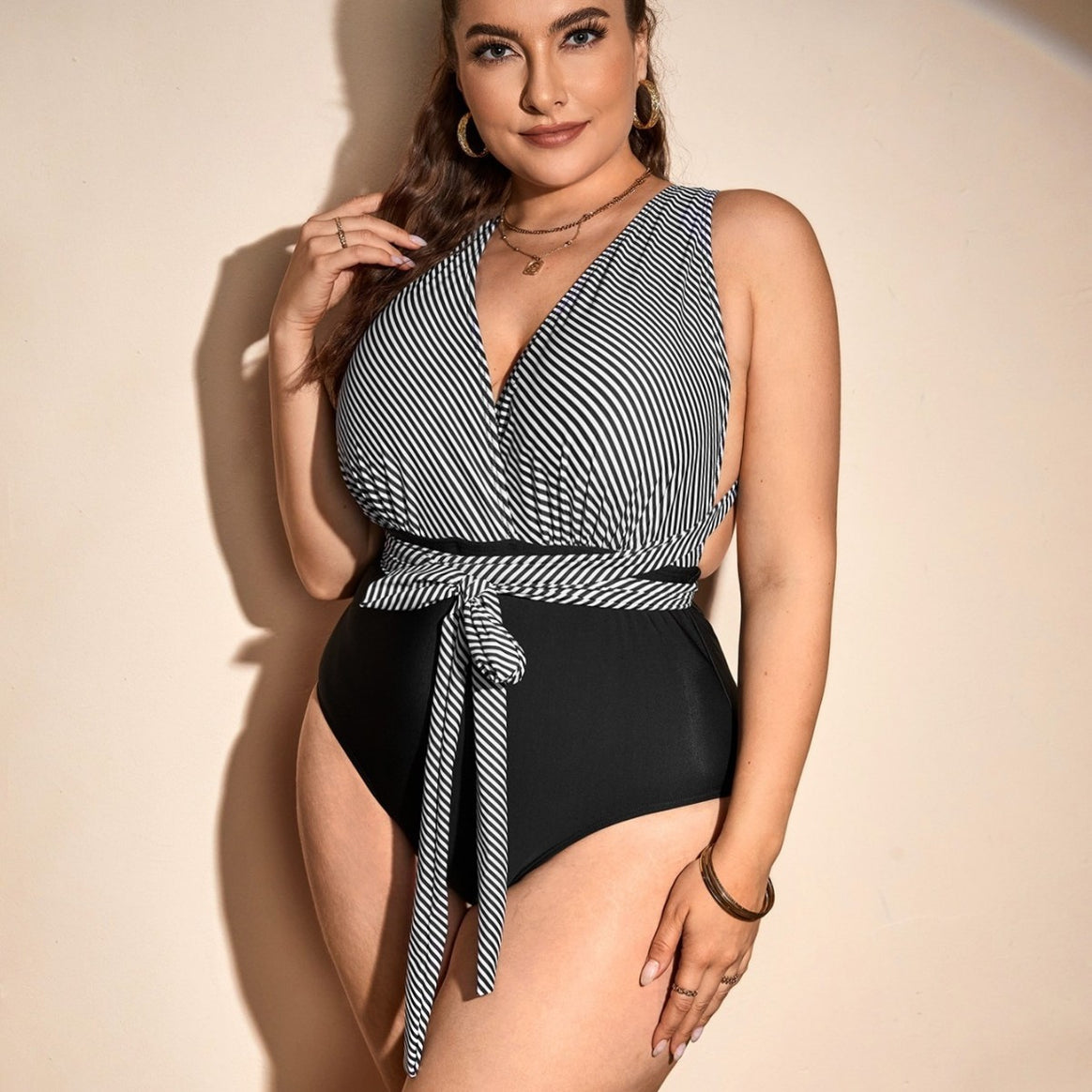 Ladies one-piece swimsuit with wrap detail and trendy stripe pattern Mune Fashion