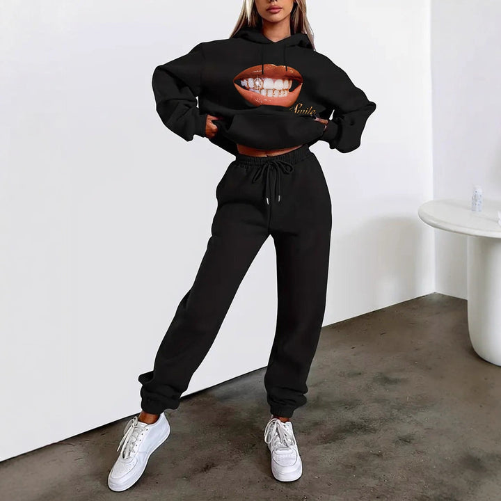 Women's hoodie and jogger set with hood, kangaroo pocket, elastic waistband, and striking lip statement print Mune Fashion
